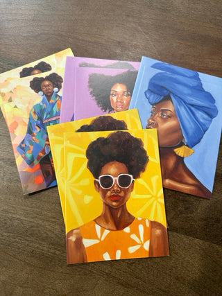 Pack of 8 greeting cards by Lauren Lane Studio featuring vibrant artwork of a confident Black woman wearing white sunglasses and an orange dress against a radiant yellow background. Cards are blank inside and come with envelopes. Perfect for any occasion.